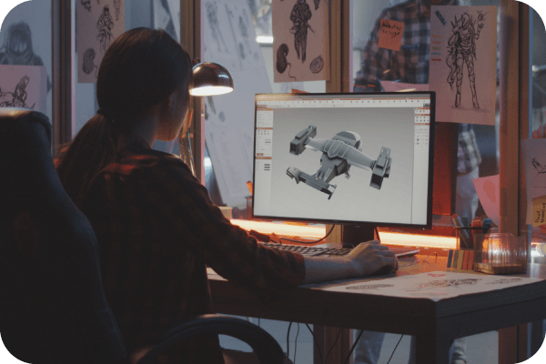 Video game developer working with 3D modeling software.