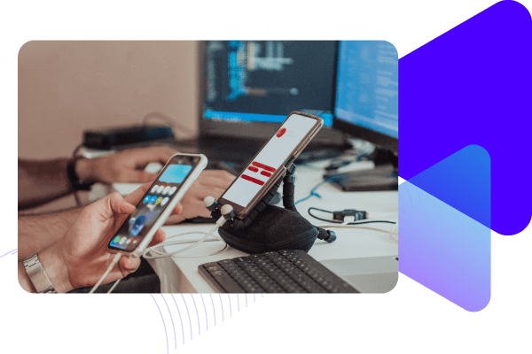 Software developers testing mobile devices.