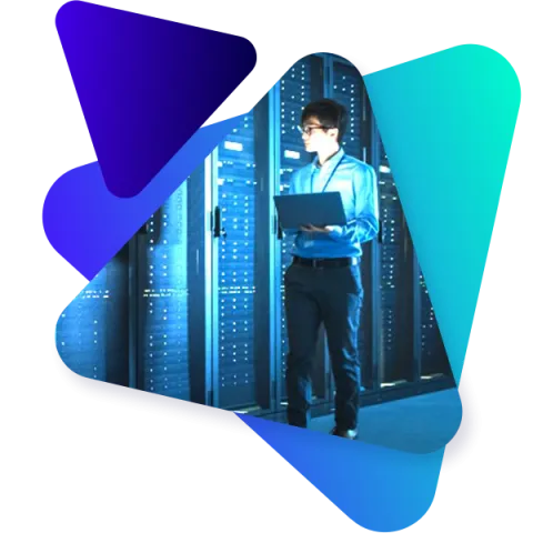 Image of IT worker in a server farm checking statuses