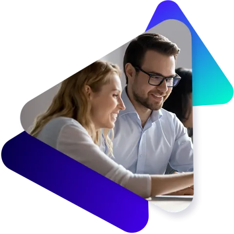 Two co-workers working on administration via laptop in a modern office